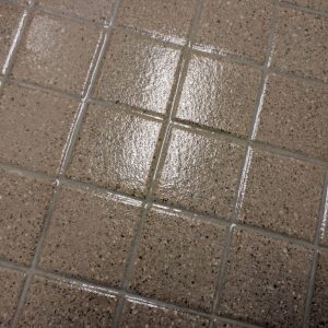 a close up of a tile floor coated with GlazeGuard Plus anti slip non slip coating